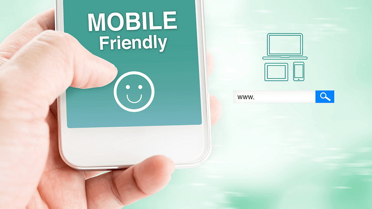 Hand holding smartphone showing "MOBILE Friendly" with device icons and a search bar.